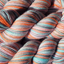 Load image into Gallery viewer, Close-up of multicolored yarn skeins with shades of tangerine orange, light cyan, and  melon pink, mid grey and lavender purple.
